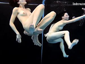 two nymphs swim and get naked sexy